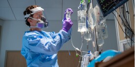 clinician using PPE equipment
