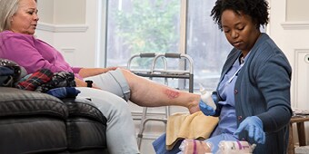 A WOCN providing wound care and management to a patient
